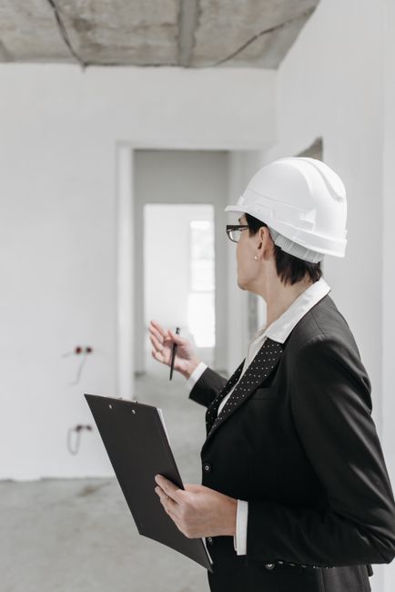 Property professional inspecting an empty room